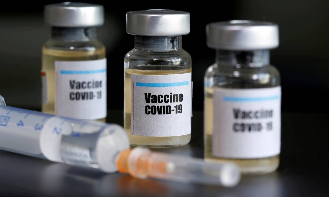 88214377_FILE-PHOTO-Small-bottles-labeled-with-a-Vaccine-COVID-19-sticker-and-a-medical-syringe-are.jpg